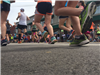 Image of runners legs with a building in the background