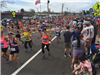 view of the mass of runners as the first wave passes through the 6 mile moment in Framingham