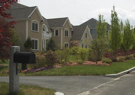view of large single family homes in a suburban neighorhood- along Doeskin Dr in Nobscot