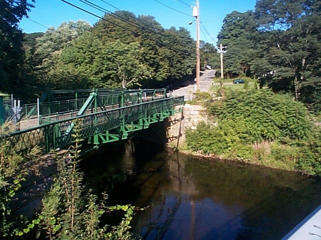 view of the restored Danforth St. bridge - green trestle bridge over the sudbury river