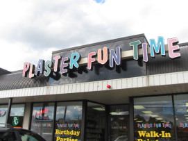 Image of the Plaster Fun Time entry sign - colorful letters at angles so they're not all straight