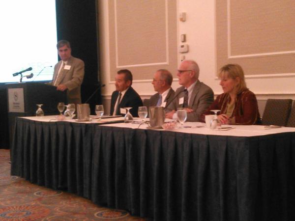 picture of a panel of experts at an event discussing the framingham economy