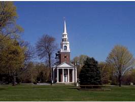 image of a traditional new england church with a brick building and pointed white steeple