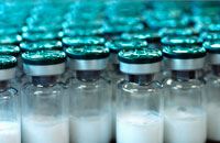 image of small sealed medical bottles - glass with blue foil caps