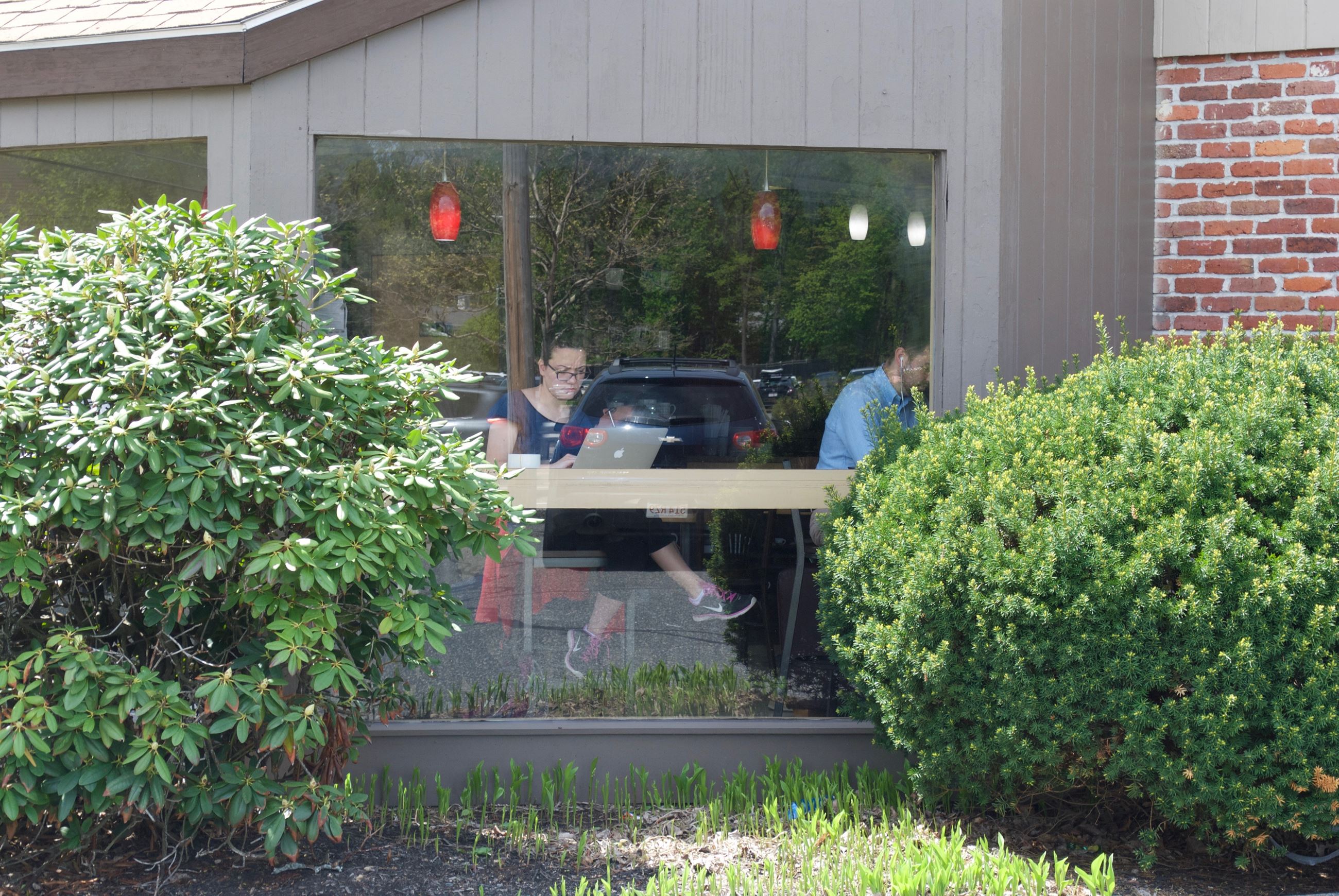 Image of a woman working in the window of the B Sisters Cafe on Route 9