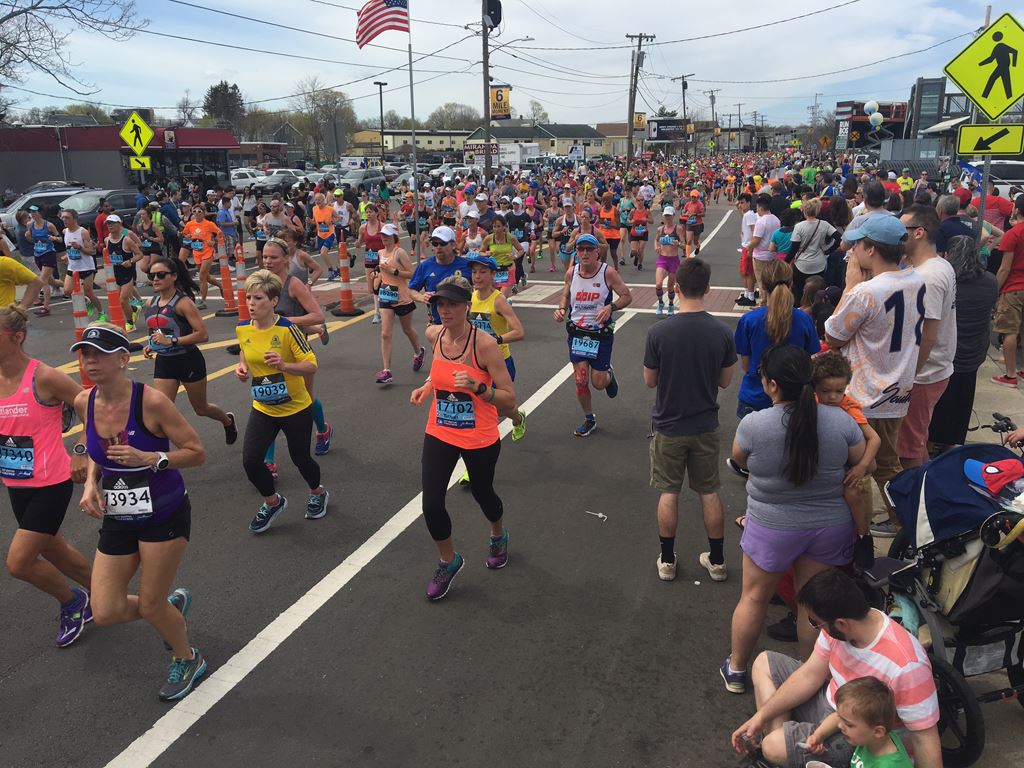 view of the mass of runners as the first wave passes through the 6 mile moment in Framingham